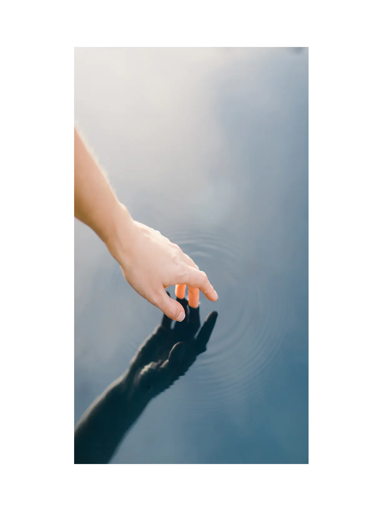 A hand touching water